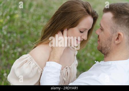 Young couple doing romance on field Stock Photo