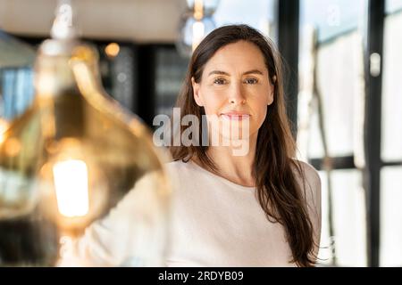 Smiling businesswoman with long brown hair Stock Photo