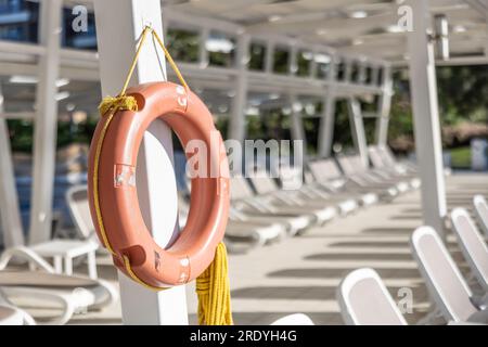 A pool with a lifebuoy in a tropical vacation resort. Stock Photo