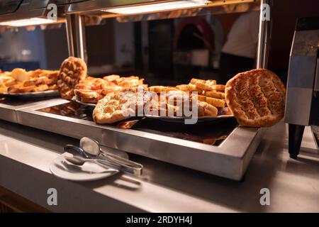 Various pastries on the buffet table in the hotel restaurant. Stock Photo