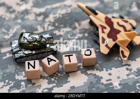 War NATO text on camouflage background Stock Photo