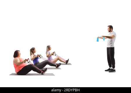 Male trainer and women exercising with a resistance bands isolated on white background Stock Photo