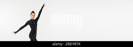 physical activity, sportswoman in black jumpsuit, athletic woman in black jumpsuit, banner, sport Stock Photo