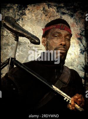 Hip young man with bicycle (retouched photograph). Stock Photo