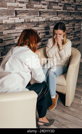 Two sisters supporting each other. Crying and consolation Stock Photo