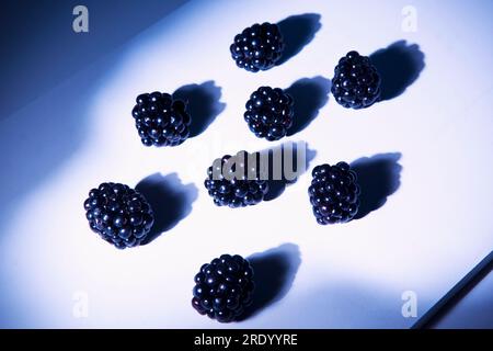 Blackberries lying on cutting board Stock Photo