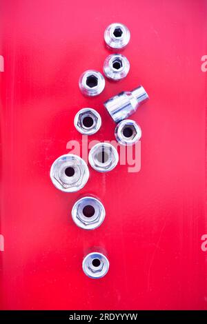 Top view on socket wrenches of a ratchet drill in red toolbox Stock Photo