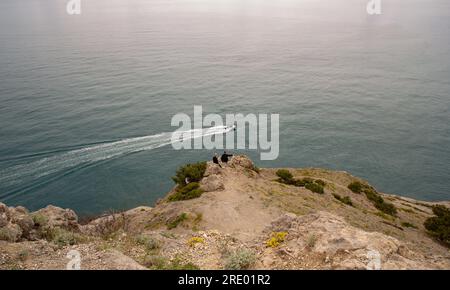 Lonely boat in the Black Sea Cove Stock Photo