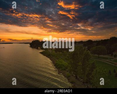 Setting sun over water. Stock Photo