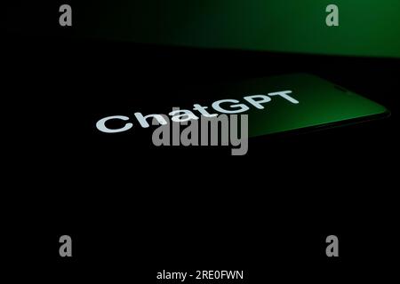 Azores, Portugal - 21.01.2023: SmartPhone Screen with ChatGPT word logo, with white letters, on a dark background, with green glow effect. Developed B Stock Photo