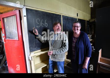 School reunion old pupils visit their former school which closed 50 years ago and has been left as it was when it closed. The Ironbridge C of E school Stock Photo