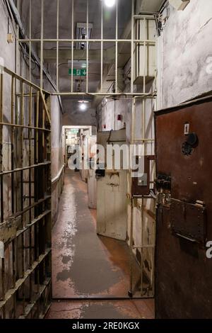 KGB Museum interior in The Corner House in Riga. A corridor with heavy cell doors and barriers Stock Photo