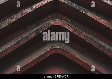 Defunct Machine Detail of the red gear of an old defunct sheet metal working machine in ...