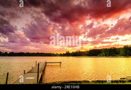 Dramatic sunset over Wing Lake in Bloomfield Township in Michigan Stock Photo