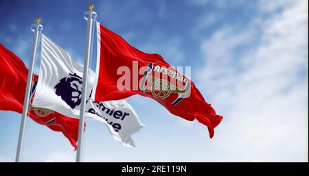 London, UK, July 18 2023: Arsenal Football Club and Premier League flags waving on a clear day. illustrative editorial 3d illustration render. Rippled Stock Photo