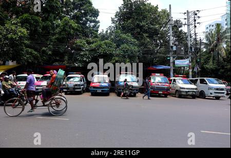 July 24, 2023, Chittagong, Chittagong Medical College Hospi, Bangladesh: July 24, 2023. Chittagong, Bangladesh : A line of private ambulances parked in front of the Chittagong Medical College Hospital in Bangladesh.Bangladesh Ambulance Malik Kalyan Samiti has announced the suspension of ambulance movement across the country for an indefinite period to realize 6-point demands including making toll free and formulating policies for ambulance movement on all roads and bridges of the country.The organization said that the movement of ambulances will be stopped across the country from 12 o'clock Stock Photo