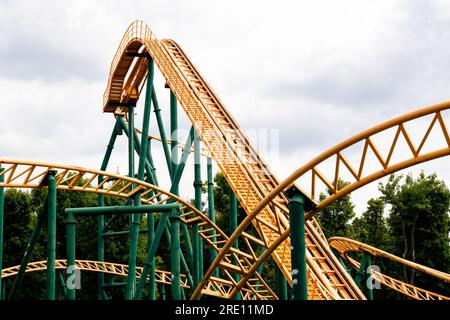 close-up image of a rollercoaster track and the cloudy sky Stock Photo
