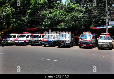 July 24, 2023, Chittagong, Chittagong Medical College Hospi, Bangladesh: July 24, 2023. Chittagong, Bangladesh : A line of private ambulances parked in front of the Chittagong Medical College Hospital in Bangladesh.Bangladesh Ambulance Malik Kalyan Samiti has announced the suspension of ambulance movement across the country for an indefinite period to realize 6-point demands including making toll free and formulating policies for ambulance movement on all roads and bridges of the country.The organization said that the movement of ambulances will be stopped across the country from 1 Stock Photo