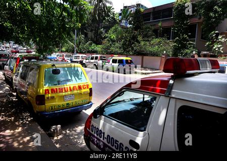 July 24, 2023, Chittagong, Chittagong Medical College Hospi, Bangladesh: July 24, 2023. Chittagong, Bangladesh : A line of private ambulances parked in front of the Chittagong Medical College Hospital in Bangladesh.Bangladesh Ambulance Malik Kalyan Samiti has announced the suspension of ambulance movement across the country for an indefinite period to realize 6-point demands including making toll free and formulating policies for ambulance movement on all roads and bridges of the country.The organization said that the movement of ambulances will be stopped across th Stock Photo