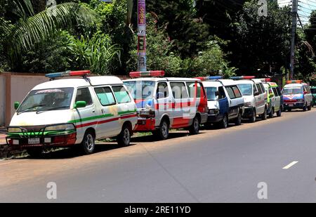 July 24, 2023, Chittagong, Chittagong Medical College Hospi, Bangladesh: July 24, 2023. Chittagong, Bangladesh : A line of private ambulances parked in front of the Chittagong Medical College Hospital in Bangladesh.Bangladesh Ambulance Malik Kalyan Samiti has announced the suspension of ambulance movement across the country for an indefinite period to realize 6-point demands including making toll free and formulating policies for ambulance movement on all roads and bridges of the country.The organization said that the movement of ambulances will be stopped across the co Stock Photo