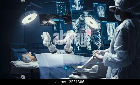 Surgeon Wearing AR Headsets And Using High-Precision Remote Controlled Robot Arms To Operate On Patient In Hospital. Doctor Controlling Robotic Limbs Stock Photo