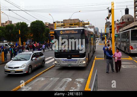 El Metropolitano C Line public bus on Av Emancipación crossing junction with Av Tacna in central Lima, Peru Stock Photo