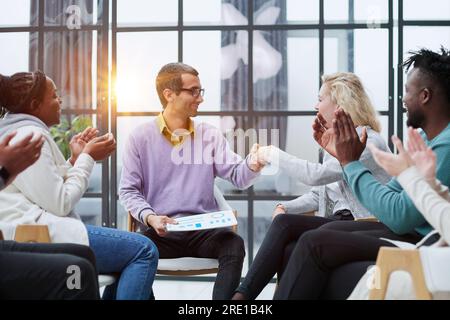 business training and coaching in the company. people sit and chat Stock Photo