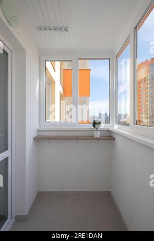 Empty balcony interior with windows in an apartment building Stock Photo