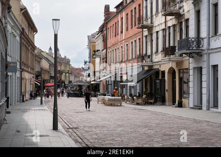 People walking on the street in Kaunas downtown on a sunny day. Kaunas, Lithuania Stock Photo