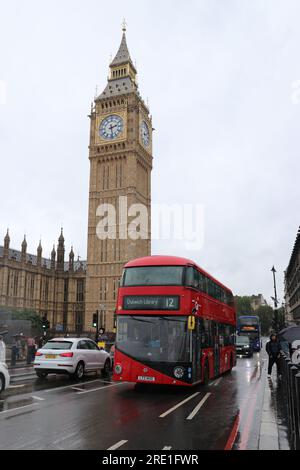 PORTRAIT VIEW OF A RED LONDON NEW ROUTEMASTER BUS PASSING BIG BEN Stock Photo