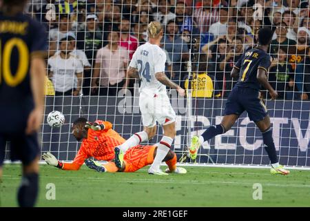 Los Angeles, United States. 23rd July, 2023. Real Madrid forward Vinícius Júnior (R) scores on AC Milan goalkeeper Mike Maignan (L) during a Soccer Champions Tour match between the AC Milan and Real Madrid FC in Pasadena. Final score: Real Madrid FC 3:2 AC Milan Credit: SOPA Images Limited/Alamy Live News Stock Photo