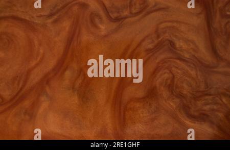 Beautiful smooth wavy brown satin, silk luxury cloth fabric texture, abstract background design. Stock Photo