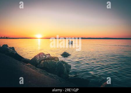 Balaton Siofok Hungary. Beautiful sunset at Lake Balaton, with reflection in the water Stock Photo