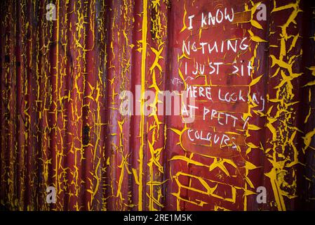 I know nothing I just sit here looking at pretty colours, written on shipping container Stock Photo