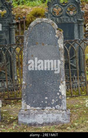 Old empty tombstone in an ancient cemetery. Stock Photo