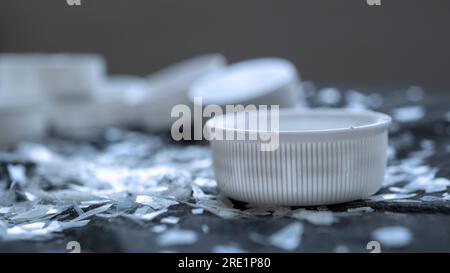 Macro shot on a pile of disintegrated micro plastic particles from plastic bottles and trash bags. Old decomposed and broken down plastic material Stock Photo