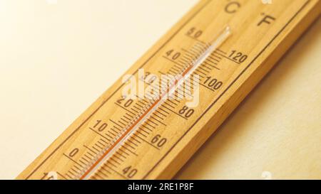 Heat waves and high-temperature concept.Wooden thermometer showing extreme temperatures during the summer season. Global warming concept Stock Photo