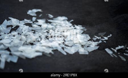 Macro shot on a pile of disintegrated micro plastic particles from plastic bottles and trash bags. Old decomposed and broken down plastic material Stock Photo