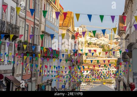 colorful baner decoration in Porto at sao joao festa saint john the baptist festival with residental building background . Stock Photo