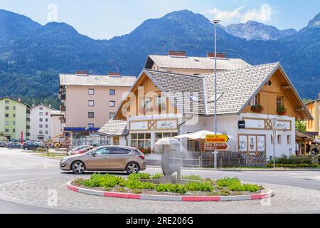 Bohinjska Bistrica, Slovenia - August 19, 2018: A view of the downtown with the Črna Prst mountains in the background, in a sunny summer day Stock Photo