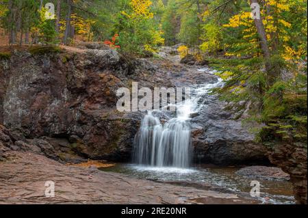 The various river features of the Amnicon River as it flows through Amnicon Falls State Park in Wisconsin. Stock Photo