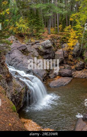 The various river features of the Amnicon River as it flows through Amnicon Falls State Park in Wisconsin. Stock Photo