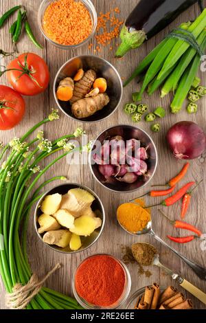 Top down shot of fresh vegetables and spices used in South Asian cooking- Indian, Pakistani, Sri Lankan cuisine. Stock Photo