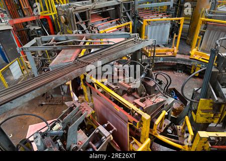 Copper flat-plate cathode being separated in an electrowinning plant Stock Photo
