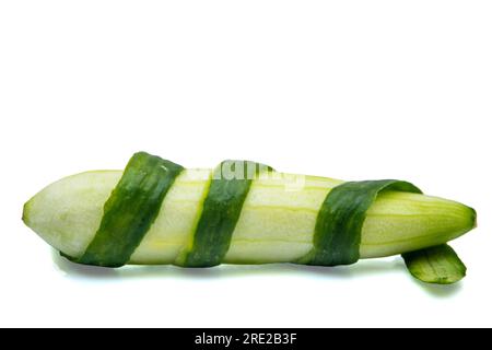 Cucumber wrapped around with cucumber peel on white isolated background Stock Photo