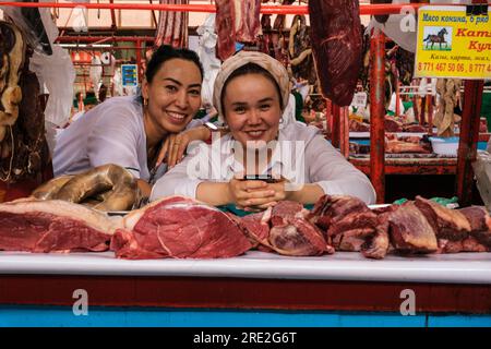 Kazakhstan, Almaty. Green Bazaar Vendor of Horsemeat Products. Stock Photo