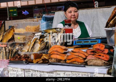 Kazakhstan, Almaty. Green Bazaar, Vendor of Fish. Stock Photo