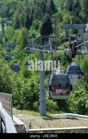 Kazakhstan, Shymbulak Ski Resort Gondola Car Lift, in the Zailiisky Alatau mountain range. Stock Photo
