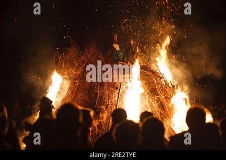 people-watch-as-an-effigy-of-