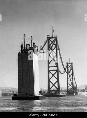 San Francisco, California:  1935 The catwalks for the construction of the cables connecting the towers of the San Francisco-Oakland Bay Bridge. Stock Photo